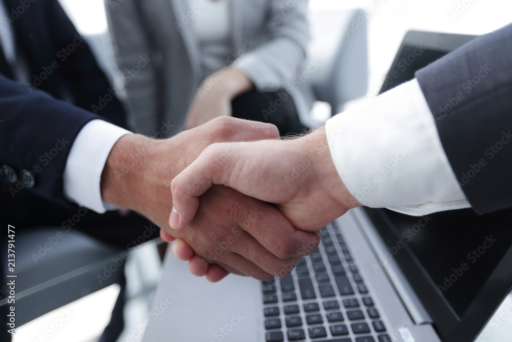 Two confidence businessman shaking hands close-up Two confidence businessman shaking hands close-up