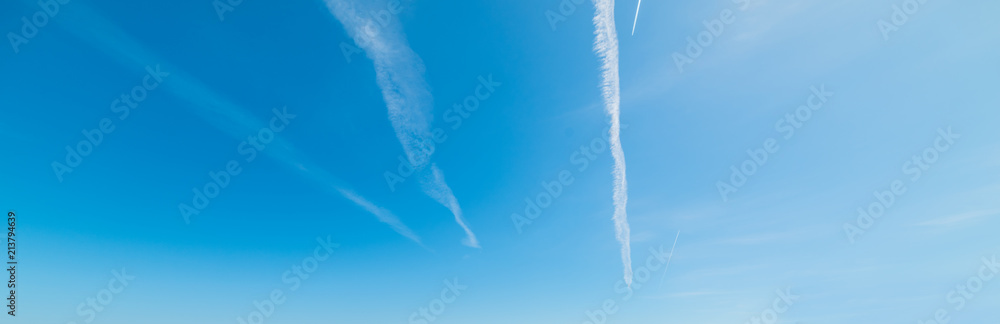 Blue sky with contrails