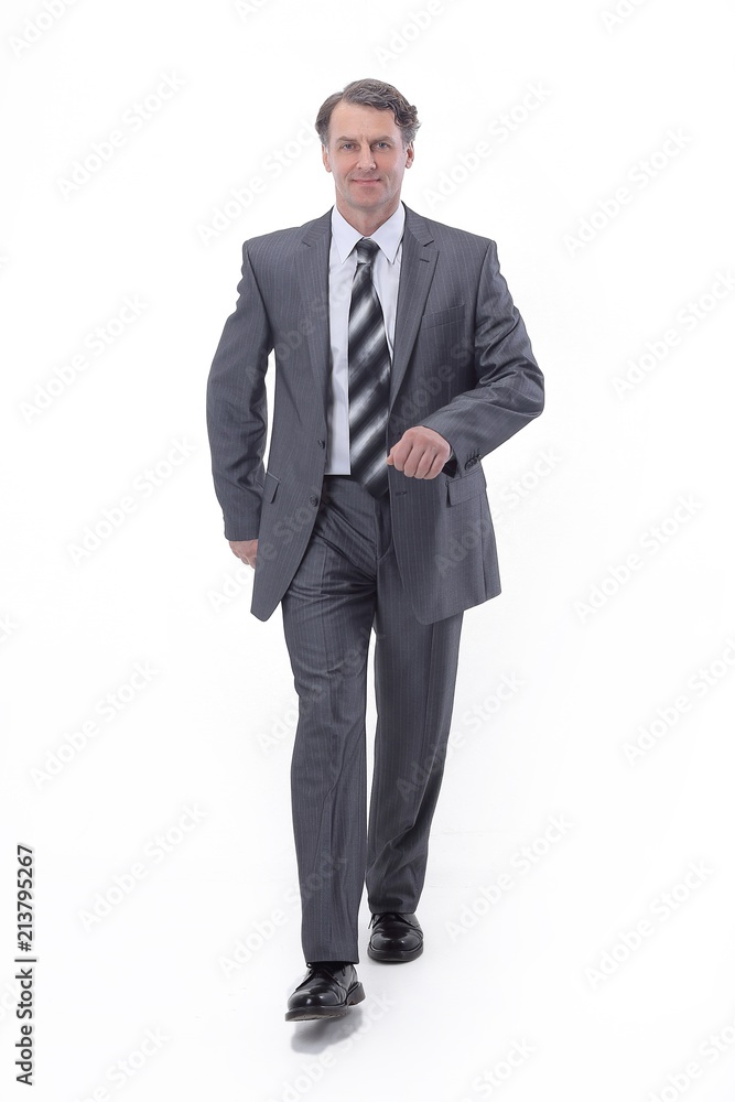 in all growth.a successful businessman, confidently striding forward. in all growth.a successful businessman, confidently striding forward.