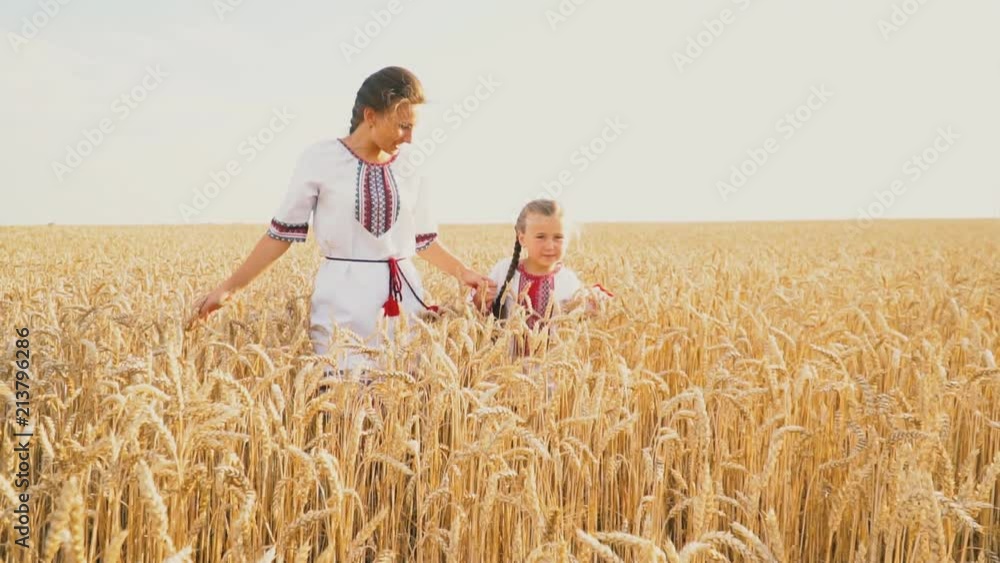 Mom and baby are going through a wheat Mom and baby are going through a wheat