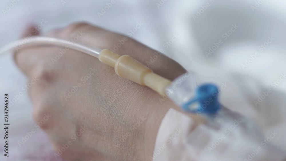 In the hospital. Close-up of a woman's hand with a catheter In the hospital. Close-up of a woman's hand with a catheter