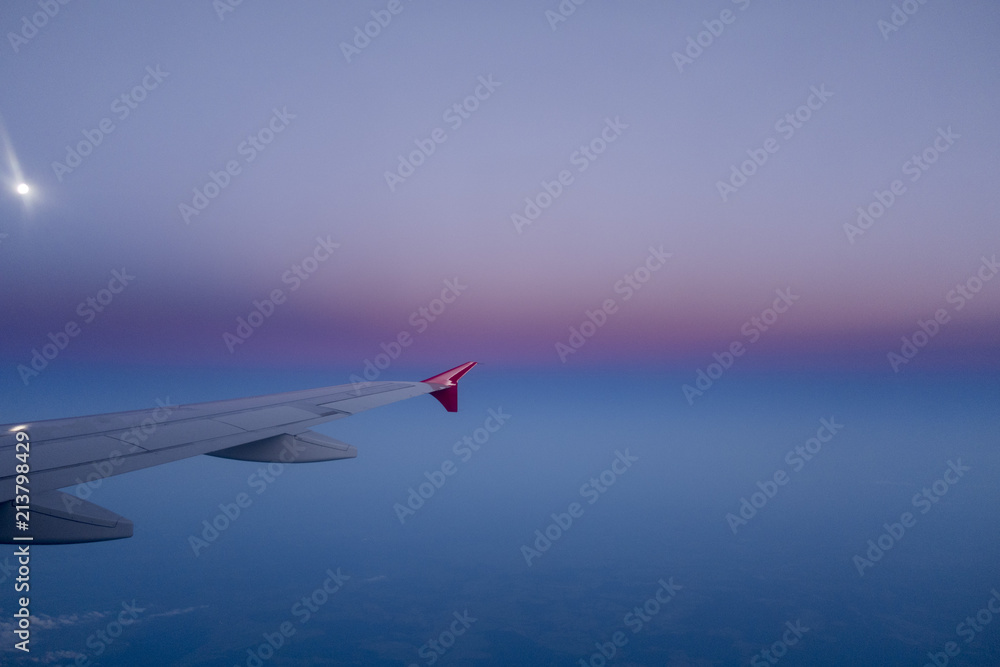 wing of an airplane in a beautiful night sky wing of an airplane in a beautiful night sky