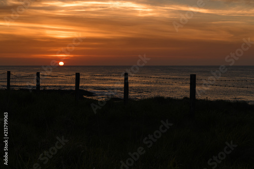 Pentland sunset. The sun setting over the Pentland Firth, Caithness, northern Scotland