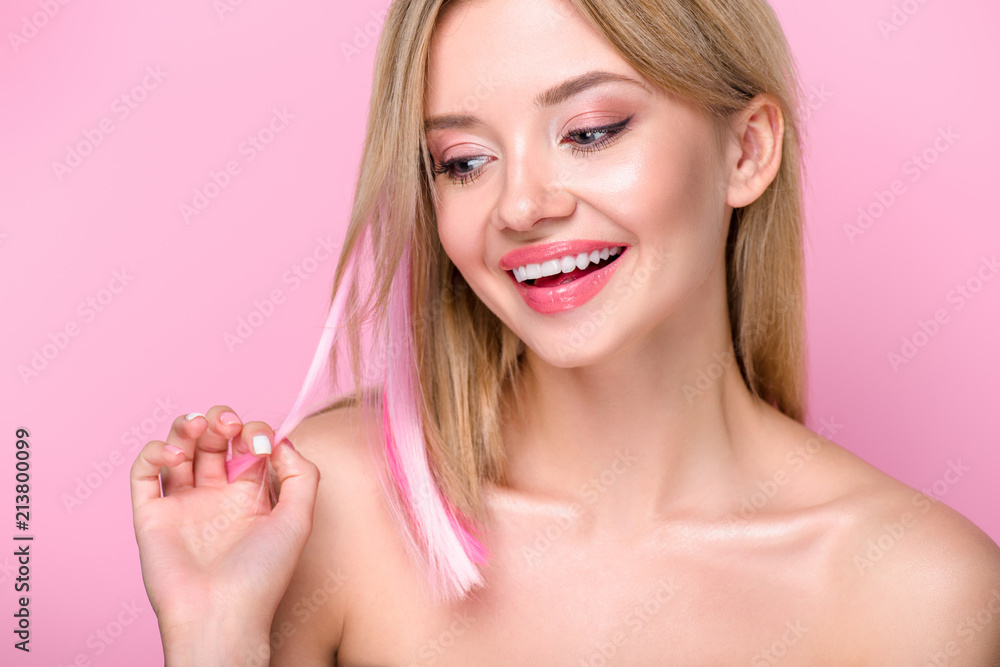 close-up portrait of happy young woman with colorful hair strands isolated on pink close-up portrait of happy young woman with colorful hair strands isolated on pink
