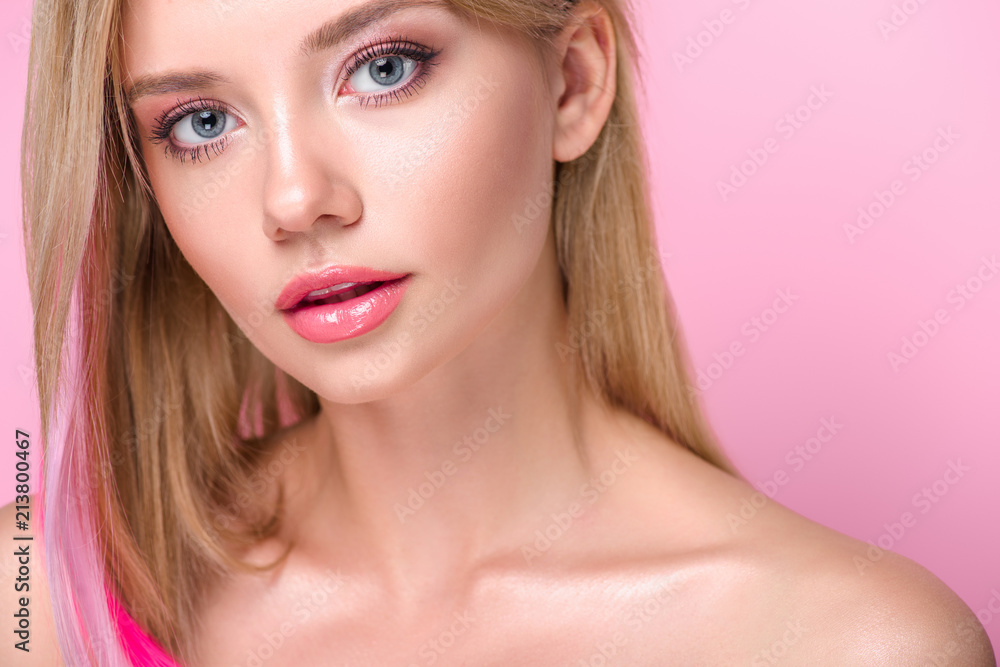 close-up portrait of beautiful young woman with colorful hair strands looking at camera isolated on pink close-up portrait of beautiful young woman with colorful hair strands looking at camera isolated on pink