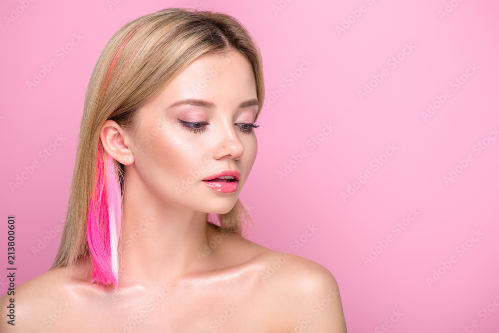 sensual young woman with colorful hair strands isolated on pink