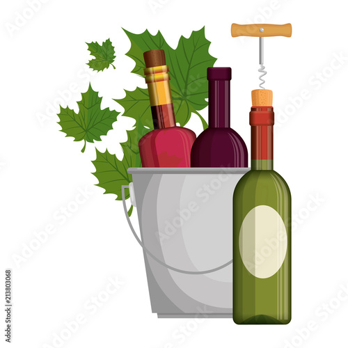 wine bottles in bucket with leafs