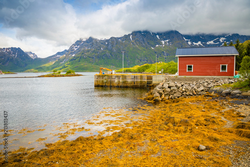 Tipical red fishing houses on fjord in Lofoten islands, Norway