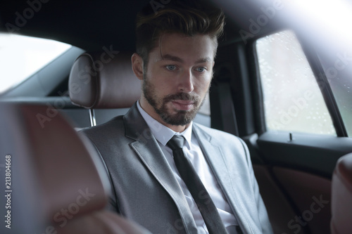 Handsome business man in car. © ASDF