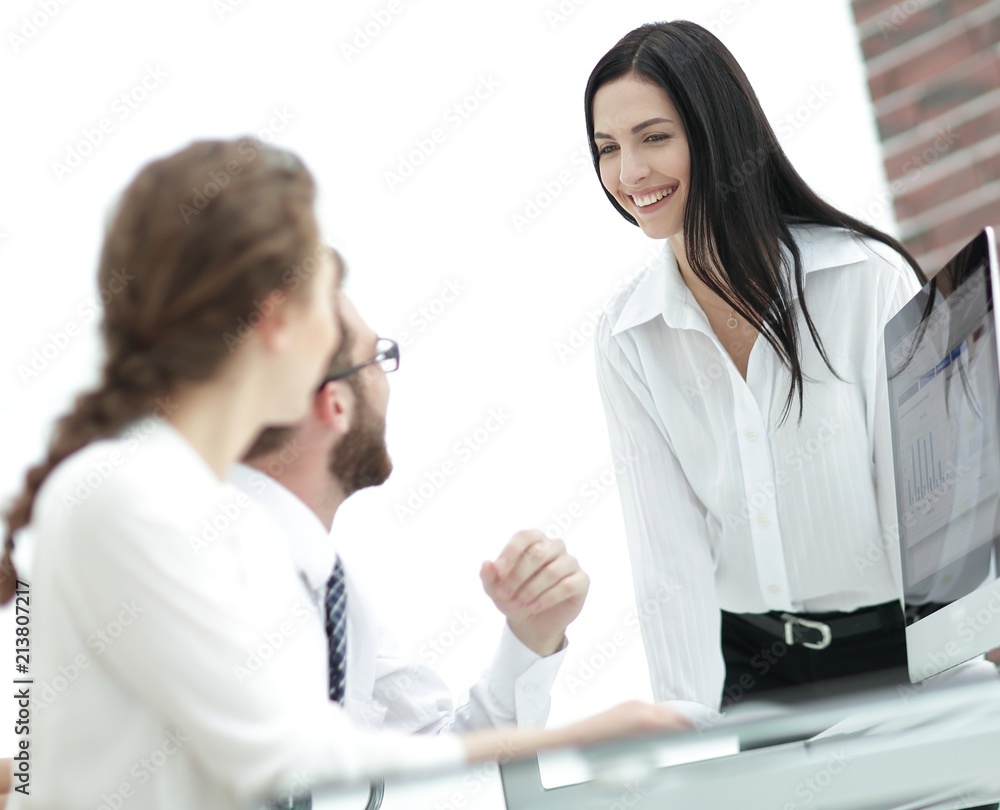 young business woman talking to colleagues in the office young business woman talking to colleagues in the office