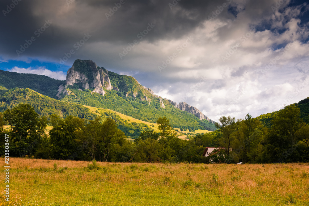 Fototapeta premium trascau mountains with piatra secuiului over the village of Rimetea - famous destination in Transylvania, Romania