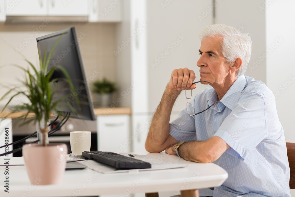 Senior man working at home. Senior man working at home.