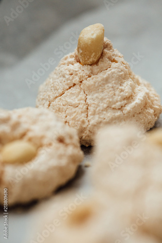 Baking tray with delicious coconut macaroons. Closeup photo