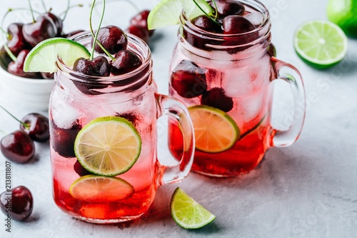 Cherry Limeade or Lemonade in glass mason jar. Ice cold summer drink.