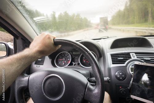 driving car on highway, close up of hands on steering wheel