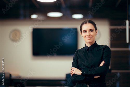 Receptionist Woman in front of Her Desk Greeting Customers