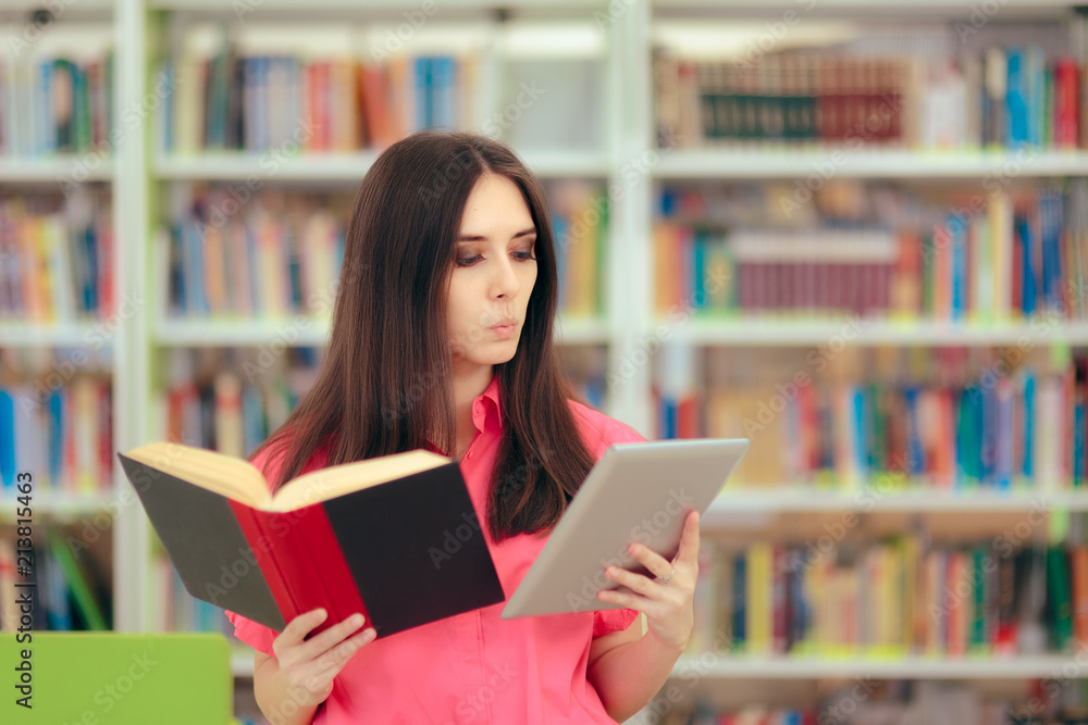 Student in Library Fact Checking Books Versus Internet Student in Library Fact Checking Books Versus Internet