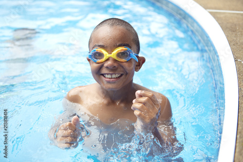 Portrait of boy having good time in swimming pool