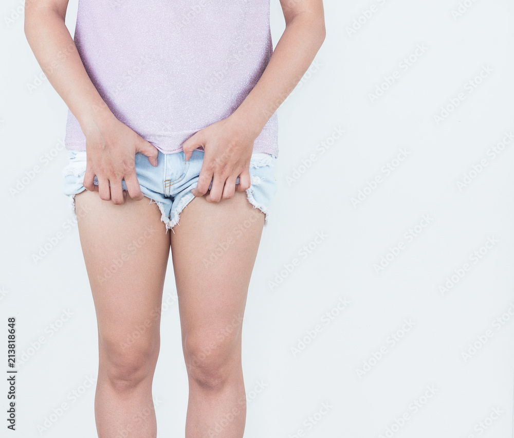 Women are scratching the crotch, itching crotch, Concept with healthcare  and medicine. Stock Photo