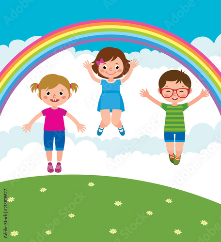 Group of kids playing and jump in the meadow under the rainbow