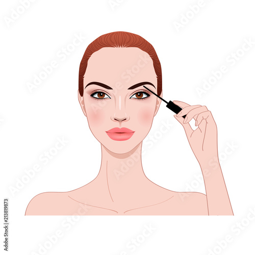 beautiful woman applying mascara makeup on eyes by brush