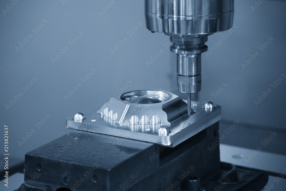 The CNC milling machine cutting the injection mold part with the solid ball endmill tool.The Hi-Technology manufacturing process. The CNC milling machine cutting the injection mold part with the solid ball endmill tool.The Hi-Technology manufacturing process.