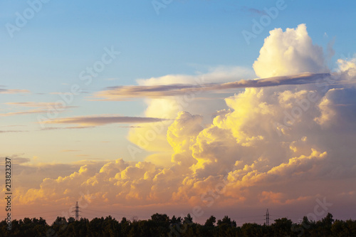 Heapy clouds with warm sunset's ray. photo