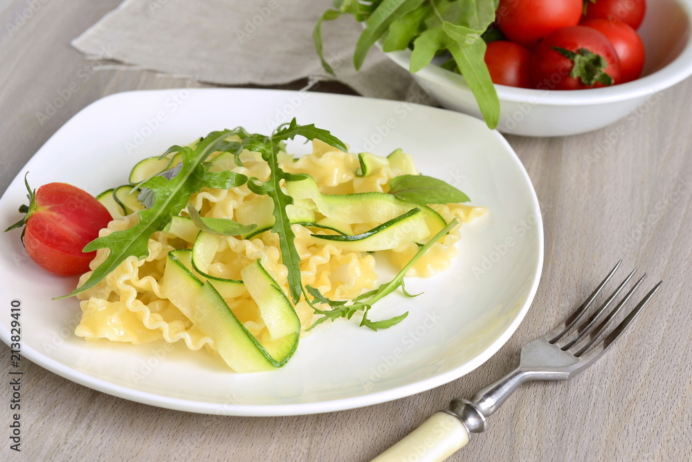 Italian pasta noodles with zucchini, arugula, basil Italian pasta noodles with zucchini, arugula, basil