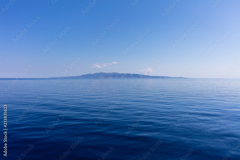 Blue sky and calm ocean sea water background