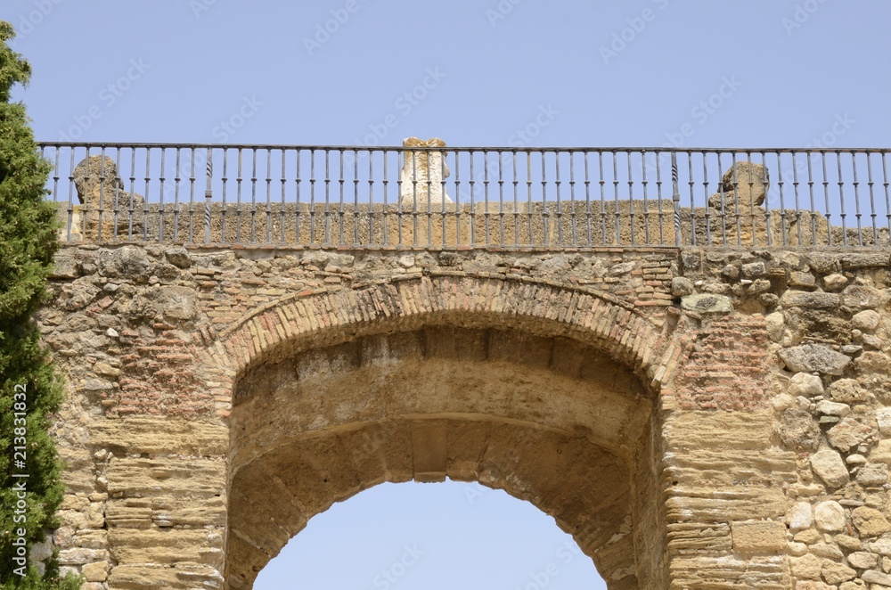 Iron rail on stone arch, Antequera, Spain.