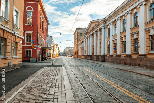 Beautiful cityscape, street in the center of Helsinki, the capital of Finland. Street with paving stones and tram ways. Popular destination for traveling in Northern Europe