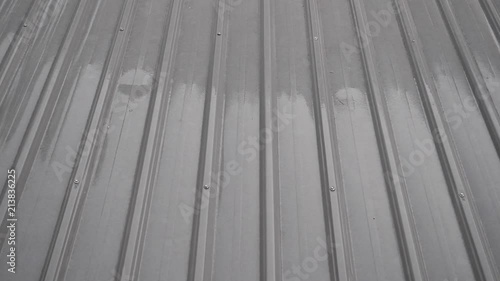 slow motion rain drop on roof house