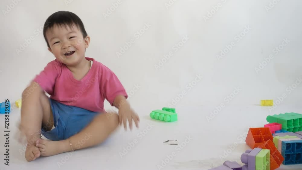 Asian baby Toddler 2 years old playing colorful blocks Asian baby Toddler 2 years old playing colorful blocks