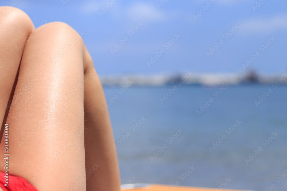 Woman legs at the beach. Happiness and lifestyle concept. Beach and sea theme. Holidays, travel, vacation and happiness concept. Woman legs at the beach. Happiness and lifestyle concept. Beach and sea theme. Holidays, travel, vacation and happiness concept.