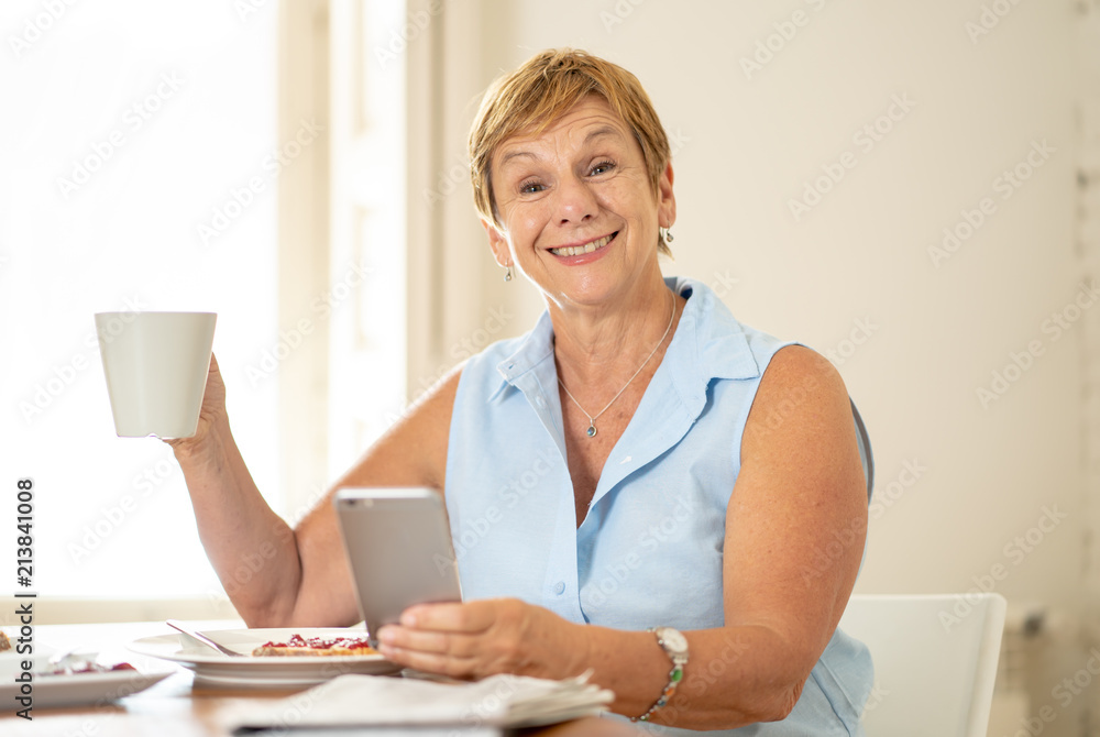 Cheerful senior retired woman using mobile phone Cheerful senior retired woman using mobile phone
