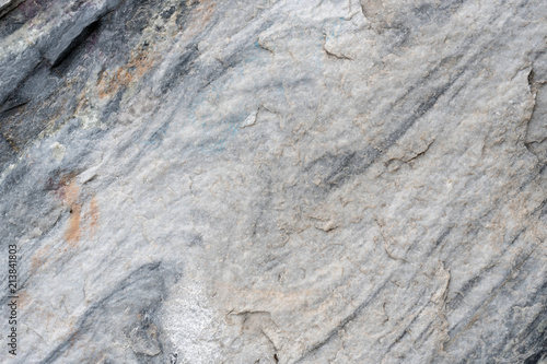Gray surface of marble stone with striped streaks.