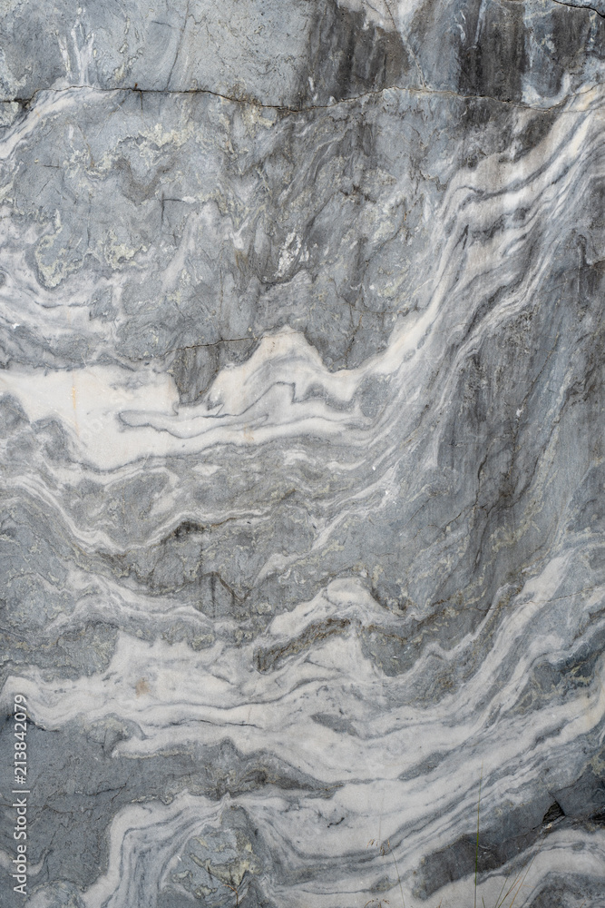 Fototapeta premium Gray surface of marble stone with striped streaks.