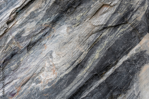 Gray surface of marble stone with striped streaks.