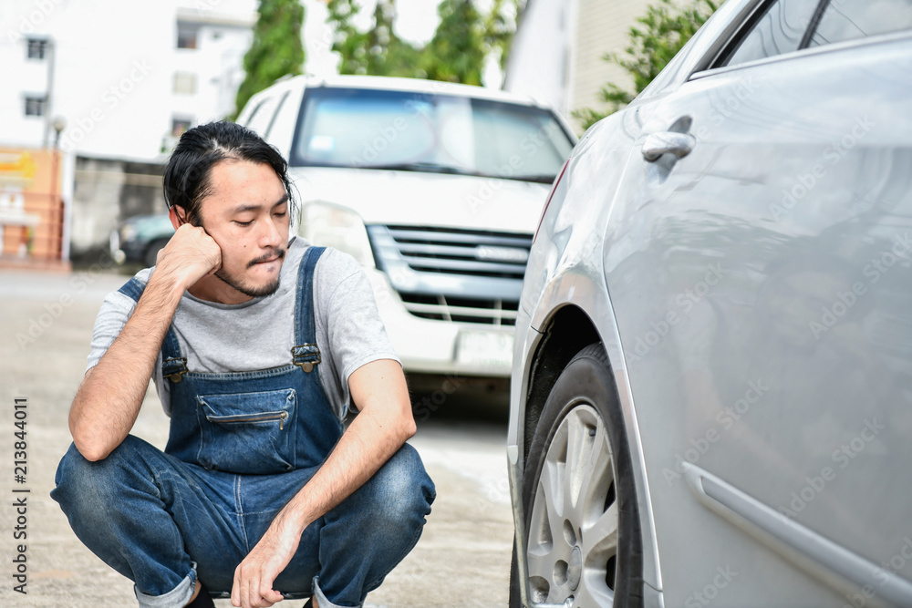 Car Repair Concept. Asian people are repairing cars on the roadside