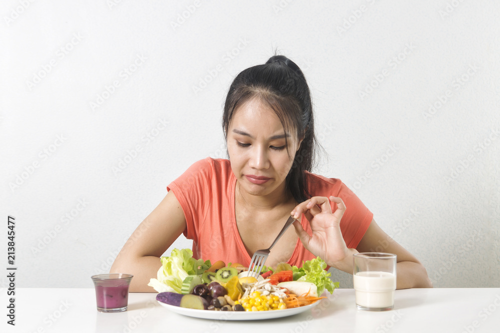 Woman does not like vegetable. Unhappy woman does not like healthy food, Emotional face. Woman does not like vegetable. Unhappy woman does not like healthy food, Emotional face.