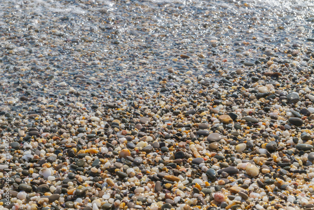 Sea stones on the seashore in the summer Sea stones on the seashore in the summer