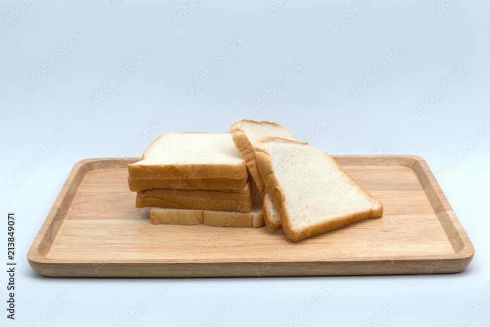 cutting wheat bread  isolated on a white background