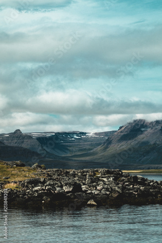 A peninsula in the foreground of a valley in the distance in Iceland