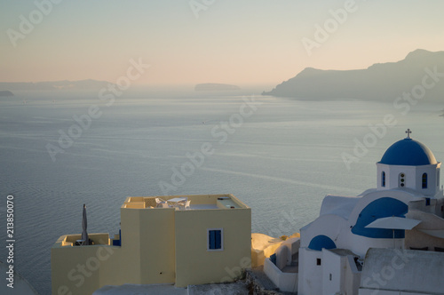 Whitewashed Houses and Church on Cliffs with Sea View in Oia, Santorini, Cyclades, Greece