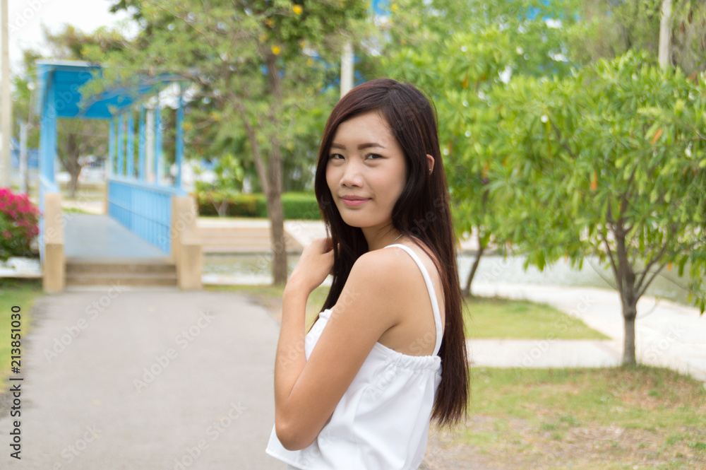 Attractive young woman enjoying her time outside in public park Attractive young woman enjoying her time outside in public park