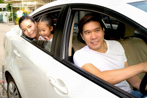 Parents and daughters are happy with their cars. © S photographer