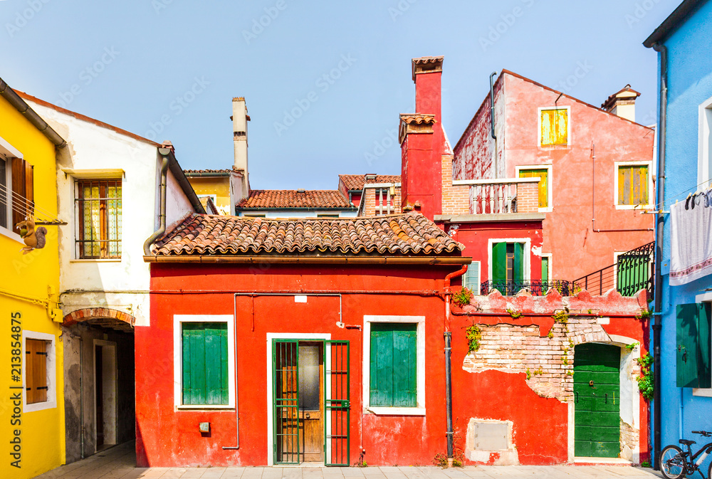 Rectilinear view of the colored facades of buildings on the island of Burano, near Venice, Italy