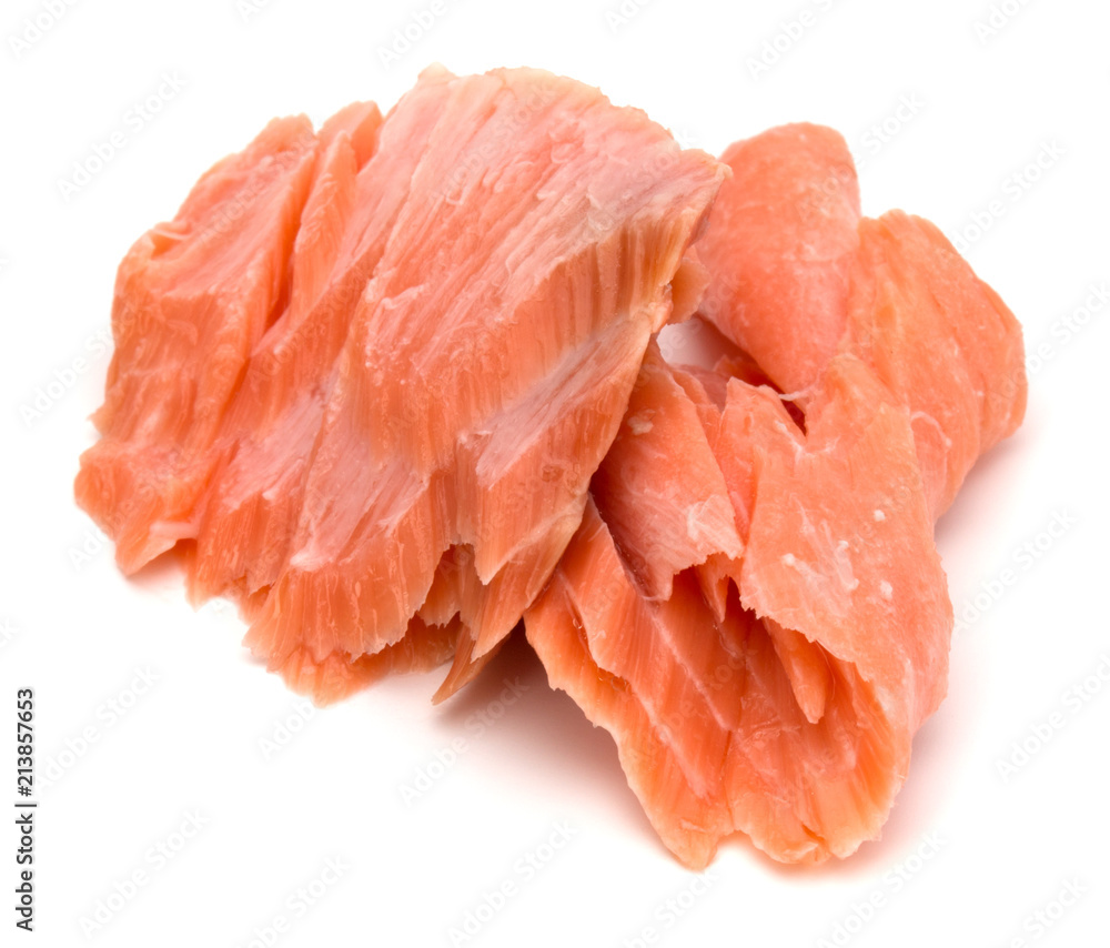 smoked salmon segments isolated on white background cutout. Prepared fish fillet fibres.