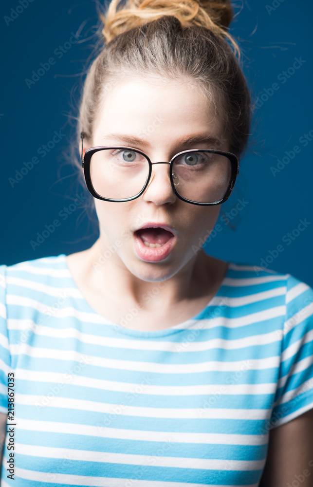 Fototapeta premium visual improvement. visual improvement of surprised teen girl in glasses. woman in glasses makes visual improvement. visual improvement clinic. now i can see you well
