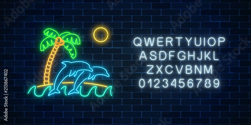 lowing neon summer sign with palm, island and jumping dolphins with alphabet in ocean. Shiny summertime symbol.